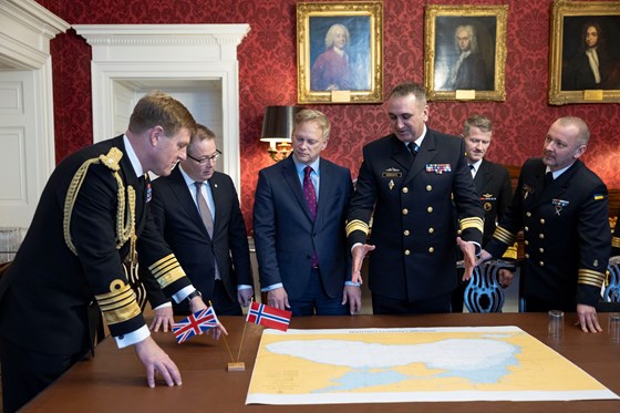 Secretary of State for Defence Grant Shapps (centre), seen here with the Norwegian Defence minister, Bjørn Arild Gram (left) and Commander of the Ukrainian Navy Olekesiy Neizhpapa (right) at a trilateral agreement between the UK, Norway, and Ukraine Dec. 11 2023.
