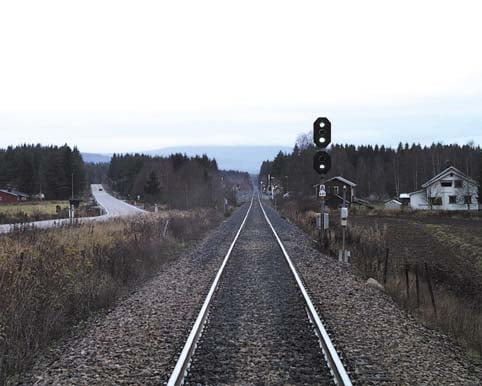 Figur 4.6 Grønt innkjørsignal til og grønt
 forsignal utkjør fra Rudstad stasjon sett sydfra
