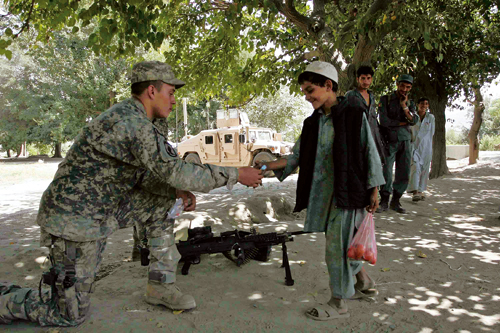 Figure 5.4 The division of responsibility between civilian and military
 organisations is put to the test in difficult security situations,
 as here in Afghanistan.