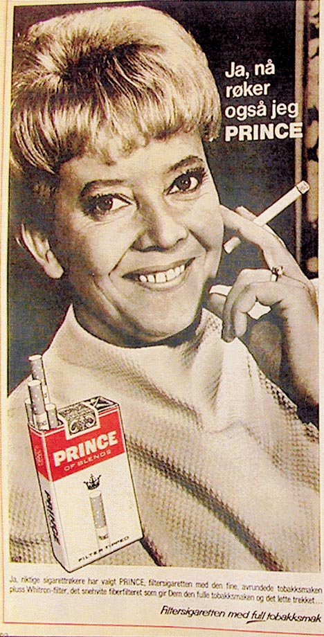 Figur 6.20 Rullevillig Gullsnitt.
  Conrad Langaard
 A/S, 1969. Sammenlign med figur 6.3. Kjønnsrollene
 er snudd. En kvinne legger en beskyttende arm rundt sin mann og
 tilbyr han et trekk fra sin sigarett.