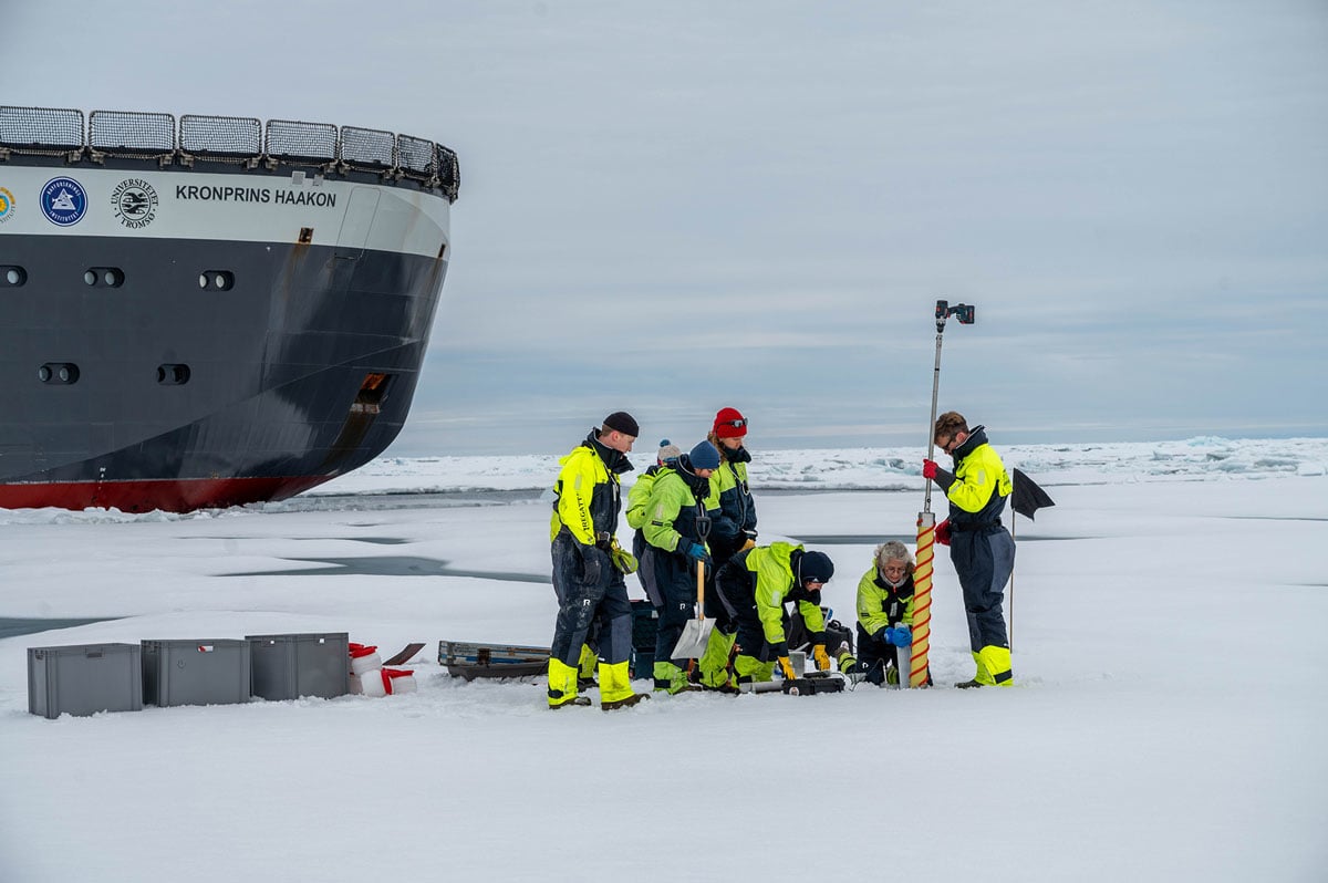Figure 8.4 The research vessel Kronprins Haakon during an expedition to the Arctic Ocean. Scientists drilling ice cores to study organisms that live within the ice.