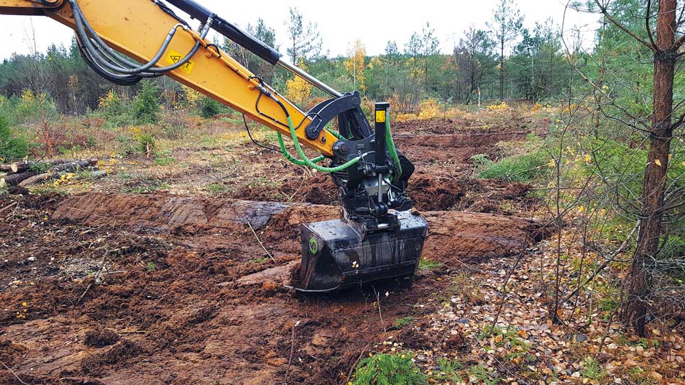 Figure 4.10 During peatland restoration, old drainage ditches are blocked with peat and other material from the site. The surface vegetation in the ditches is removed by the excavator before infilling and then replaced.