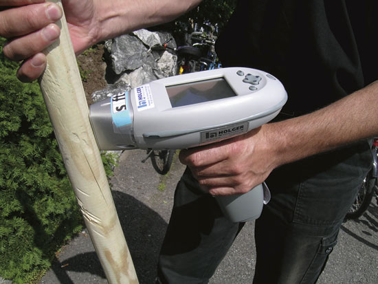 Figure 11.2 Measuring the heavy metal content of impregnated timber