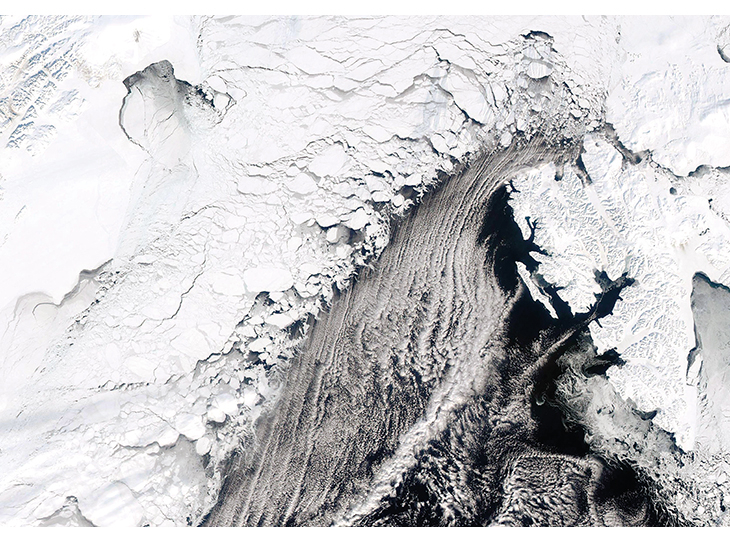 Figure 2.10 Satellite image of ice cover west of Svalbard on 11 April 2013. The image shows a system of large and small ice floes with leads and openings between them that extends far into the drift ice from the fractured outer part of the zone. The fast ice in ...