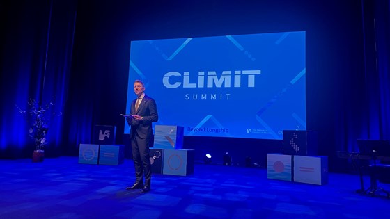 Minister Terje Aasland speaks at the Climit Summit stage