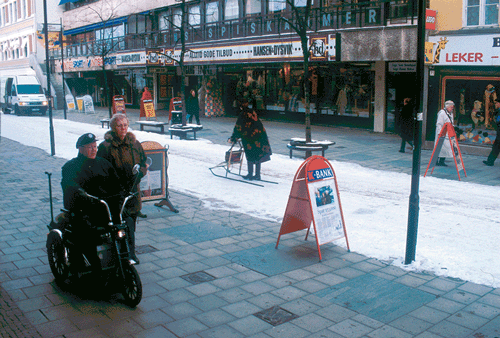 Figure 5.13 The Pedestrian Shopping Street in Hamar is constructed for multiple users. During winter, the pavement is heated and gives zones for sales, pedestrians and furniture. In the middle, it is possible to utilise several conveyances, e.g. chair sledge or ...