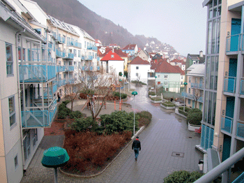 Figure 5.7 The Birkebeiner-quarter at Fjell, Bergen. The opening in the buildings lets the sun in, and gives a good view of the city. There is a kindergarten in the ground floor, and entire outdoor-area can be utilised as playground. Under the courtyard, the pa...