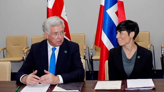 Michael Fallon and Ine Eriksen Søreide signed the declaration at the NATO Summit.