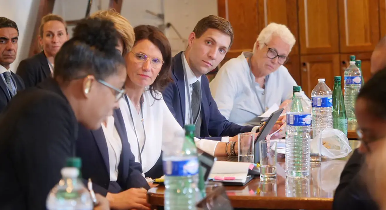 A group of people in a meeting room