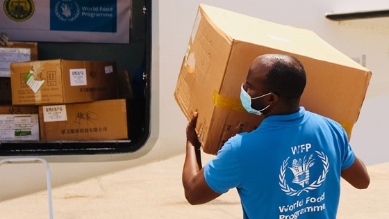 A WFP staffer loads protective equipment onto plane in Somalia. WFP is airlifting masks, disposable clothing and face shields to Somaliland, Puntland, Jubaland and South West State, via the UN Humanitarian Air Service. Credit: Jama Hassan, WFP