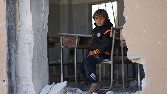 Ahmad, 6, sits in his damaged classroom at the education compound that was attacked in Has, rural Idleb, on 26 October 2016. “I wanted to become a doctor, but I don’t think this is possible anymore because the school was hit. I became afraid of coming here. My dad is saying he will move us to another school in a new village,” Ahmad says. ©UNICEF/2016/Syria/Idleb/Khalil Ashawi  