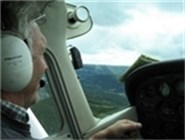 Pilot Einar Bratvold som har god oversikt over skogen i Oppland. Foto: FM i Oppland